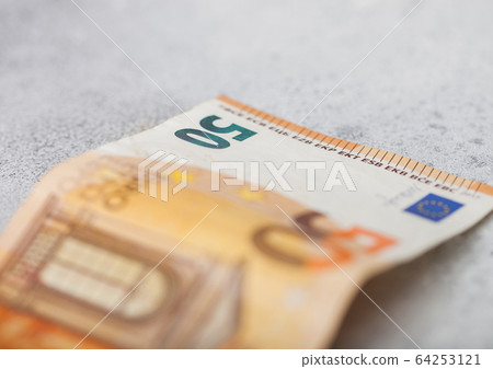 Fifty euro banknote close up on light background. 64253121