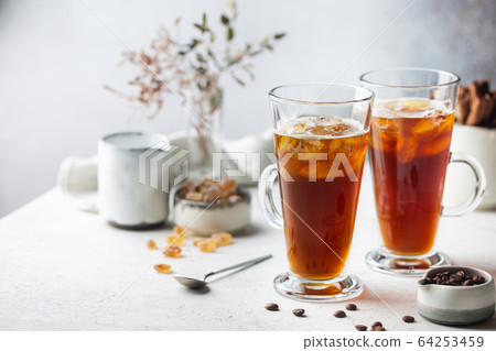 Iced coffee in a tall glass 64253459