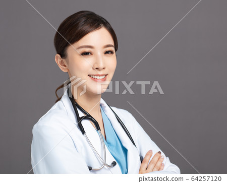Smiling asian female doctor in white coat Smiling asian female doctor in white coat 64257120