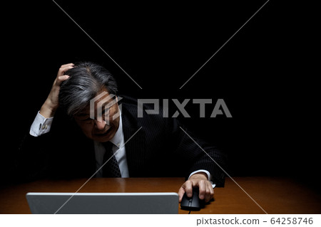 A man with a tragic feeling Black back suit figure executive president officer bureaucrat A man with a tragic feeling Black back suit figure executive president officer bureaucrat 64258746