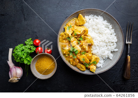 chicken cooked with curry sauce chicken cooked with curry sauce 64261856