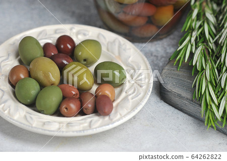 olives in a plate, and olives in a glass jar olives in a plate, and olives in a glass jar 64262822