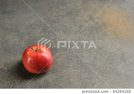 red Apple on a gray background - top view 64264288