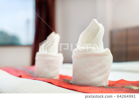 Close up of roll towel on bed decoration interior Close up of roll towel on bed decoration interior 64264991