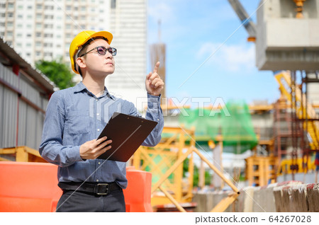 Young asian engineers are working on the construction site and surveying for making contour plans 64267028