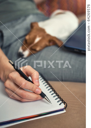 Woman write plans in the notebook with her jack Woman write plans in the notebook with her jack 64269576