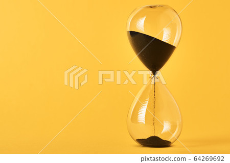 Hourglass on the yellow background with copy Hourglass on the yellow background with copy 64269692