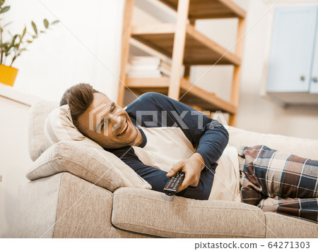 Smiling Man Winks Joyfully While Staying At Home 64271303