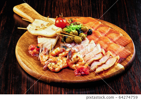 A plate of Seafood Cocktail on top of a wooden table A plate of Seafood Cocktail on top of a wooden table 64274759