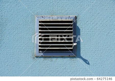 square metal ventilation grate in a blue wall, 64275146