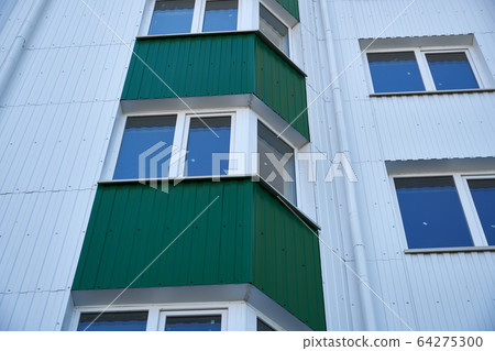 facade of a new multi-storey building with white 64275300