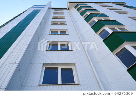 facade of a new multi-storey building with white 64275309