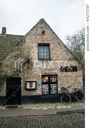 Cityscape of Bruges, Belgium-Brick building and bicycle leaned against wall Cityscape of Bruges, Belgium-Brick building and bicycle leaned against wall 64275397