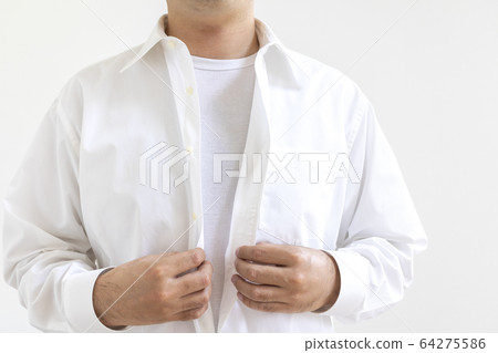 A man changing into a shirt 64275586