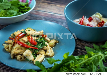 Traditional Thai flavor food.Pad ka prao is a famous food of Thailand people.Spicy sweet basil leaf with garlic chilly and meat stir in the cuisine. 64275916