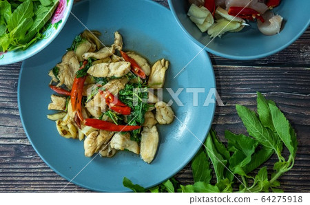 Traditional Thai flavor food.Pad ka prao is a famous food of Thailand people.Spicy sweet basil leaf with garlic chilly and meat stir in the cuisine. 64275918
