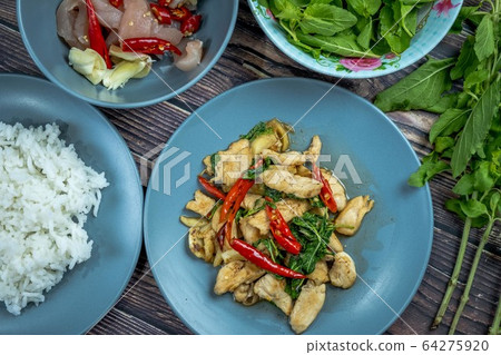 Traditional Thai flavor food.Pad ka prao is a famous food of Thailand people.Spicy sweet basil leaf with garlic chilly and meat stir in the cuisine. 64275920