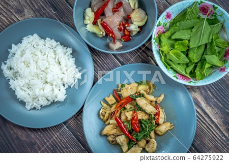 Traditional Thai flavor food.Pad ka prao is a famous food of Thailand people.Spicy sweet basil leaf with garlic chilly and meat stir in the cuisine. 64275922