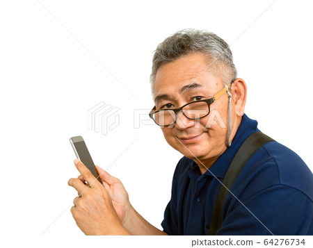 Old Asain man holds mobile phone and smiles 64276734
