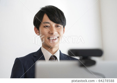 Young man speaking to webcam Online interview Video chat image 64278588