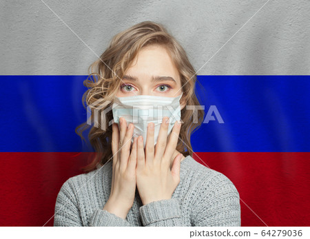 Shocked woman in medical mask on Russian flag 64279036