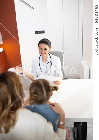 Caucasian beautiful doctor telling about results of clinical research 64281465