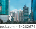 a Lot of Buildings with blue sky near the park 64282674