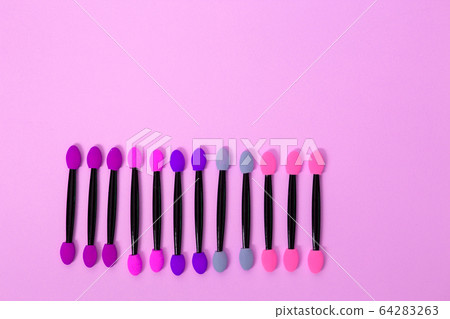 Professional makeup brush on colorful background Professional makeup brush on colorful background 64283263