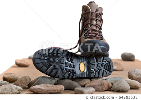 Pair of walking boots in the studio. 64283535