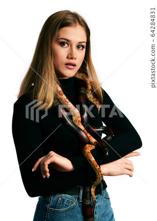 Beautiful woman in black bodywear and snake. Beautiful woman in black bodywear and snake. 64284831