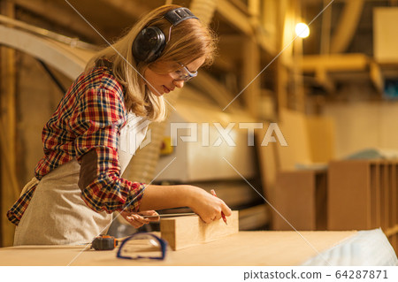 hardworking carpenter woman at workplace hardworking carpenter woman at workplace 64287871