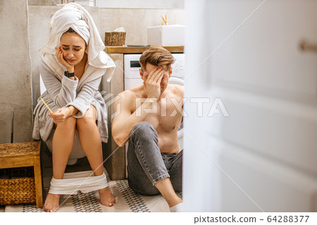 unintended pregnancy for young caucasian couple 64288377