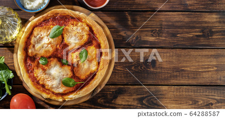 Top view of vegan pizza margherita with 64288587