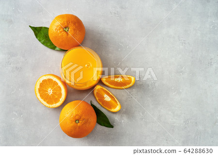 Close up of freshly squeezed orange juice in a Close up of freshly squeezed orange juice in a 64288630