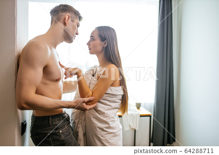 obsessed caucasian couple in love at home 64288711