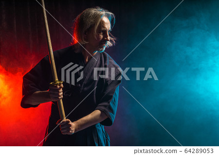 portrait of caucasian man kendo fighter with bokuto 64289053