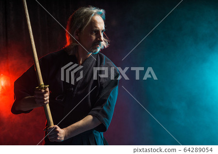 real kendo fighter ready to fight with enemy 64289054
