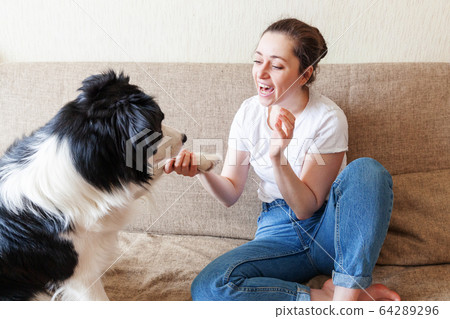 Stay Home Stay Safe. Smiling young attractive Stay Home Stay Safe. Smiling young attractive 64289296