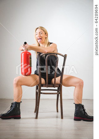 Beautiful blonde girl, dressed in a blue dress 64289694