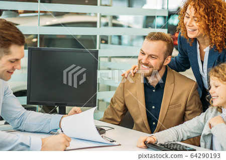 caucasian family in dealership 64290193