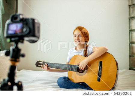 young blogger perform music at camera young blogger perform music at camera 64290261