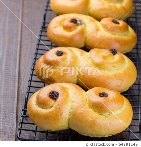 Swedish and scandinavian Christmas saffron buns Swedish and scandinavian Christmas saffron buns 64291149
