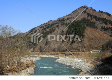 The Fuzawa River and the Mt.Kurayama of the melting snow Tadami Town, Fukushima Prefecture 64291355
