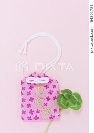 Amulet and four leaf clover Amulet and four leaf clover 64291721