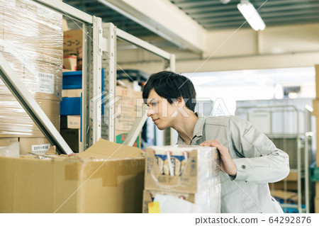 Logistics warehouse work staff 64292876