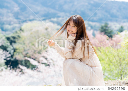 A woman wearing a one piece 64299598