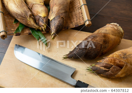 Bamboo shoots on a cutting board 64307812