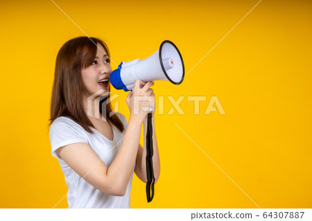 Young Asian woman in white casual t-shirt looking Young Asian woman in white casual t-shirt looking 64307887