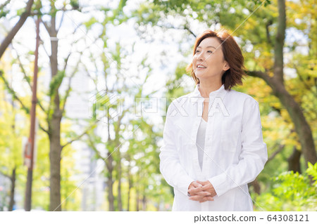 Senior woman going out 64308121