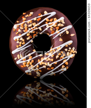 Glazed chocolate donut with nuts on a black background rotated 64309859